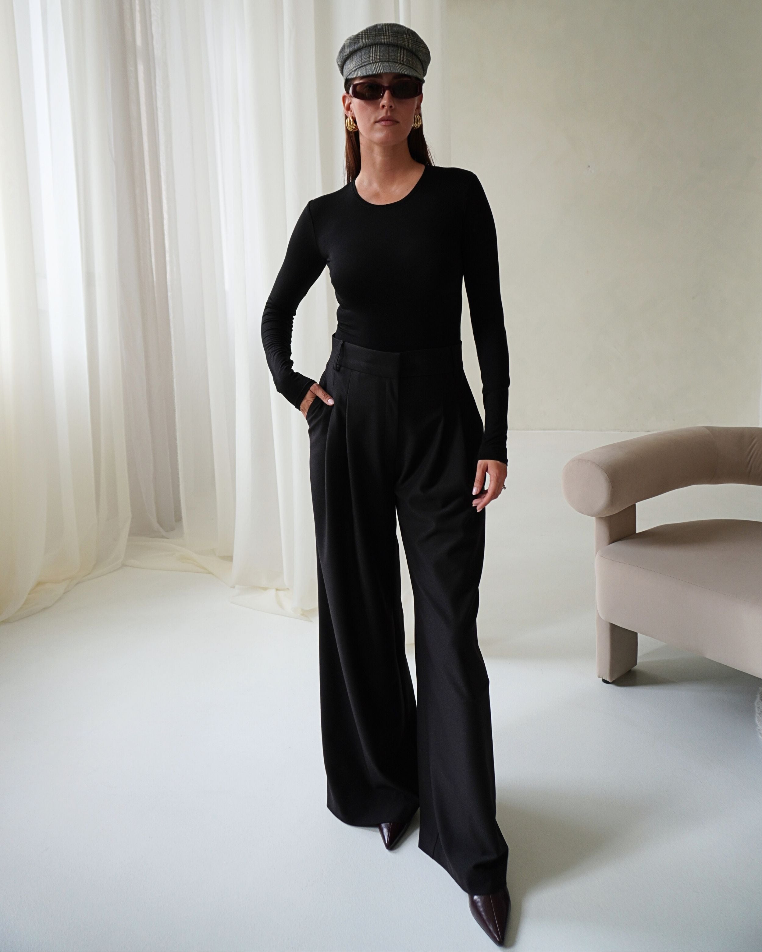 Model wearing THÉFI Essential waist-shaping long-sleeve top.
