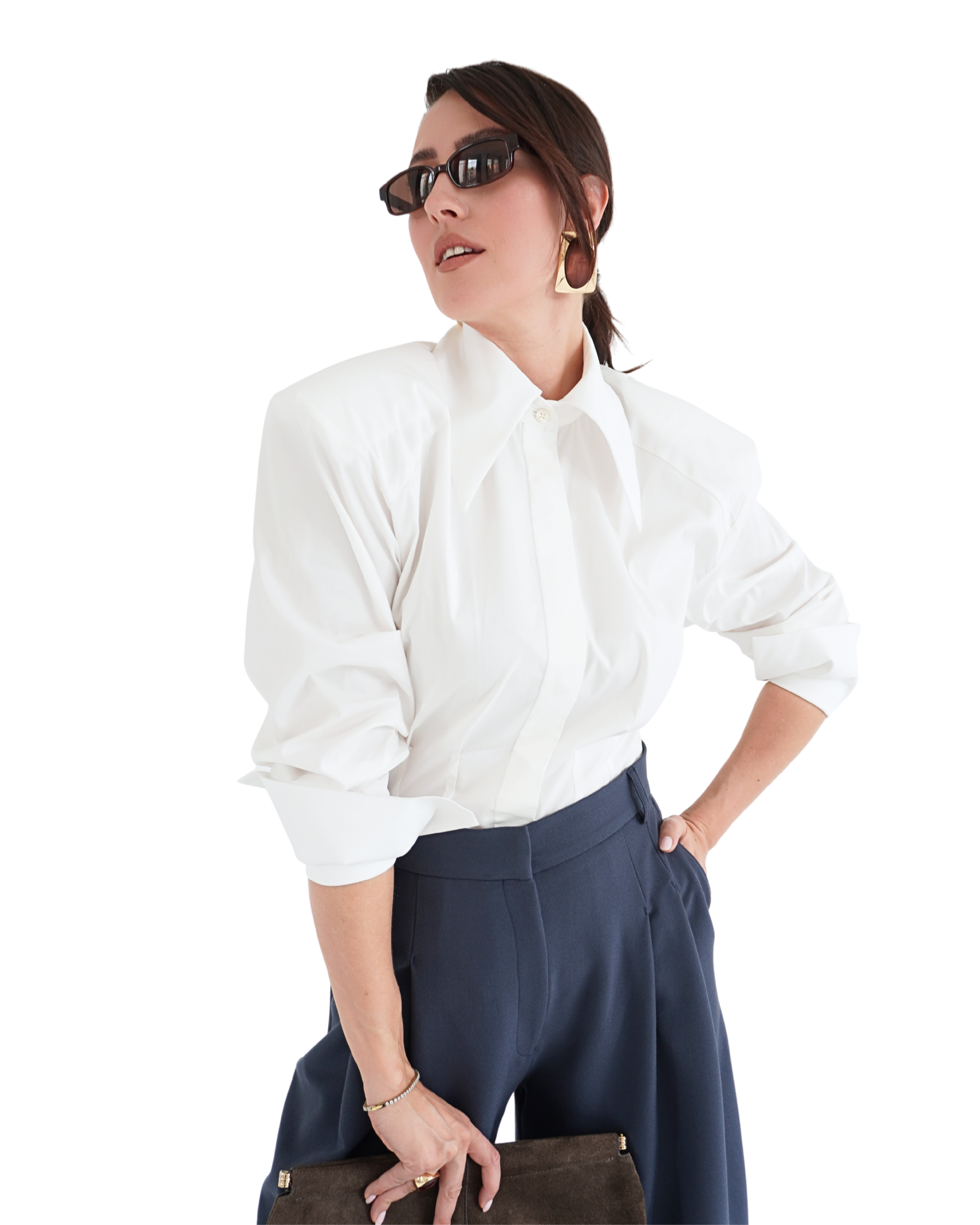 White Athéna shirt styled in an elegant outfit highlighting structured shoulders and a defined waist for a confident feminine silhouette THÉFI