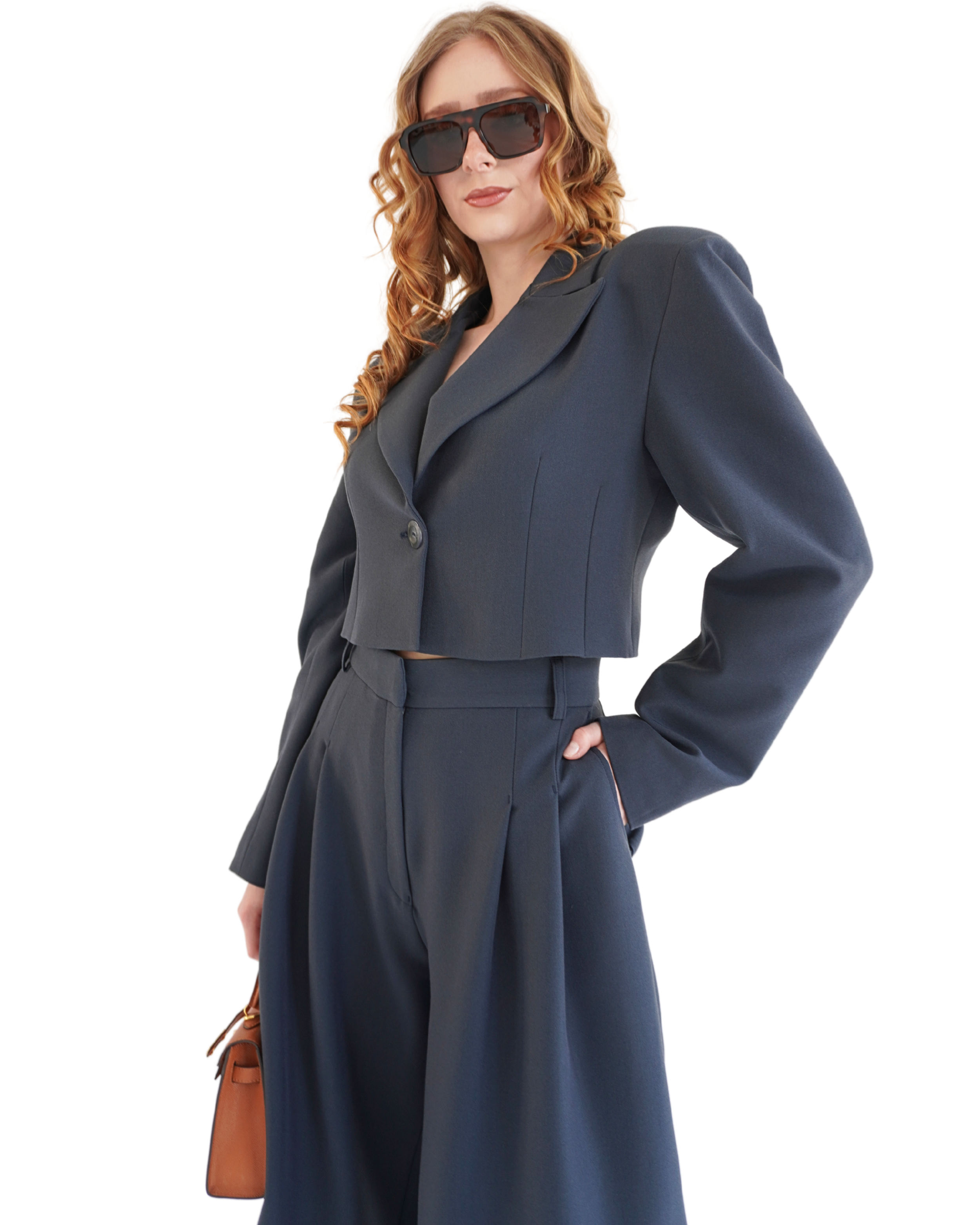 Side view of navy Delia bermuda shorts styled with blazer creating a confident feminine silhouette THÉFI