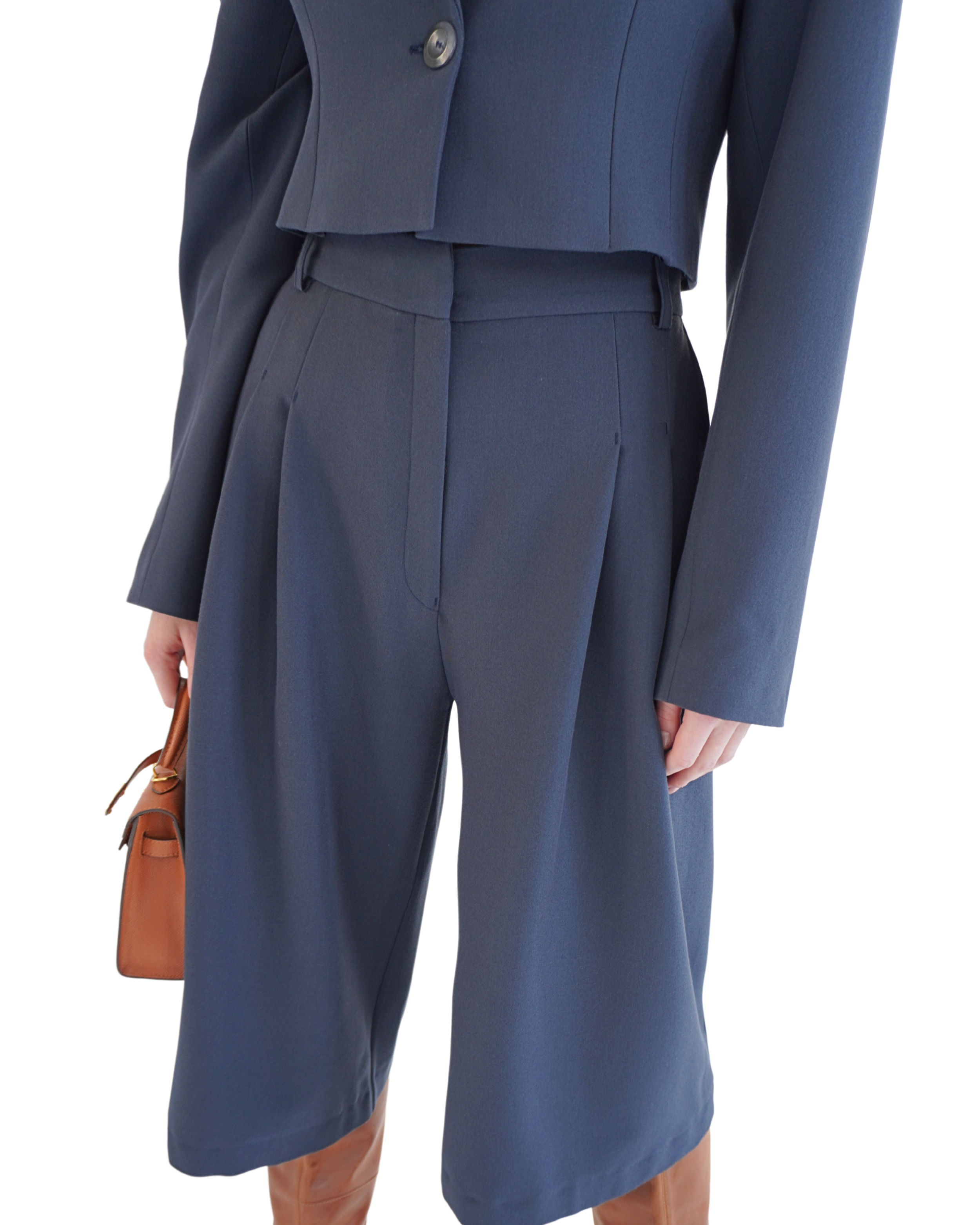 Side view of navy Delia bermuda shorts styled with blazer creating a confident feminine silhouette THÉFI