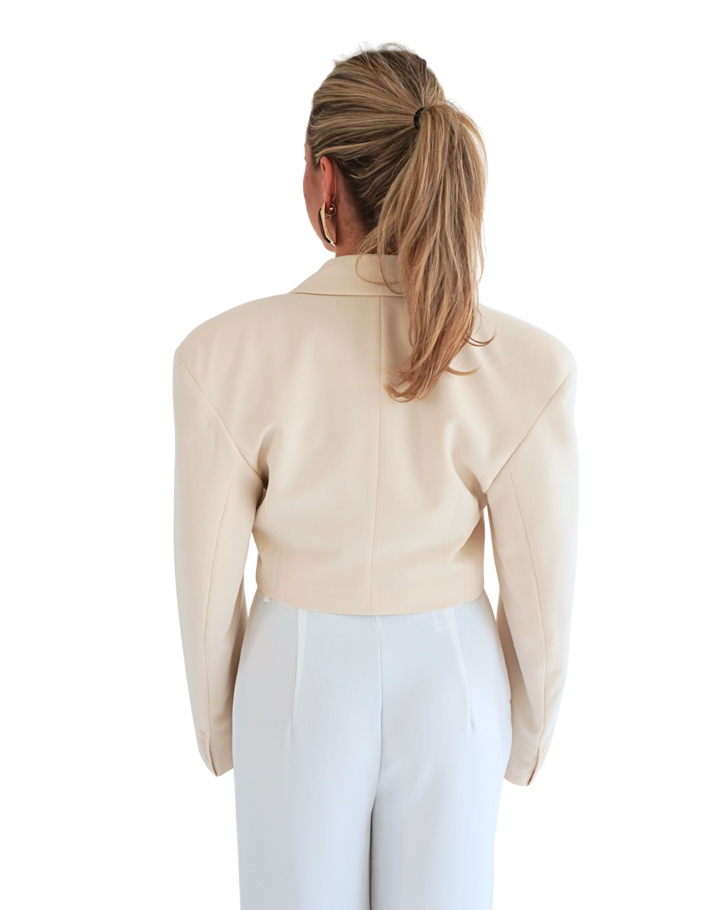 Back view of beige apricot crop blazer THÉFI showcasing clean lines and fitted silhouette