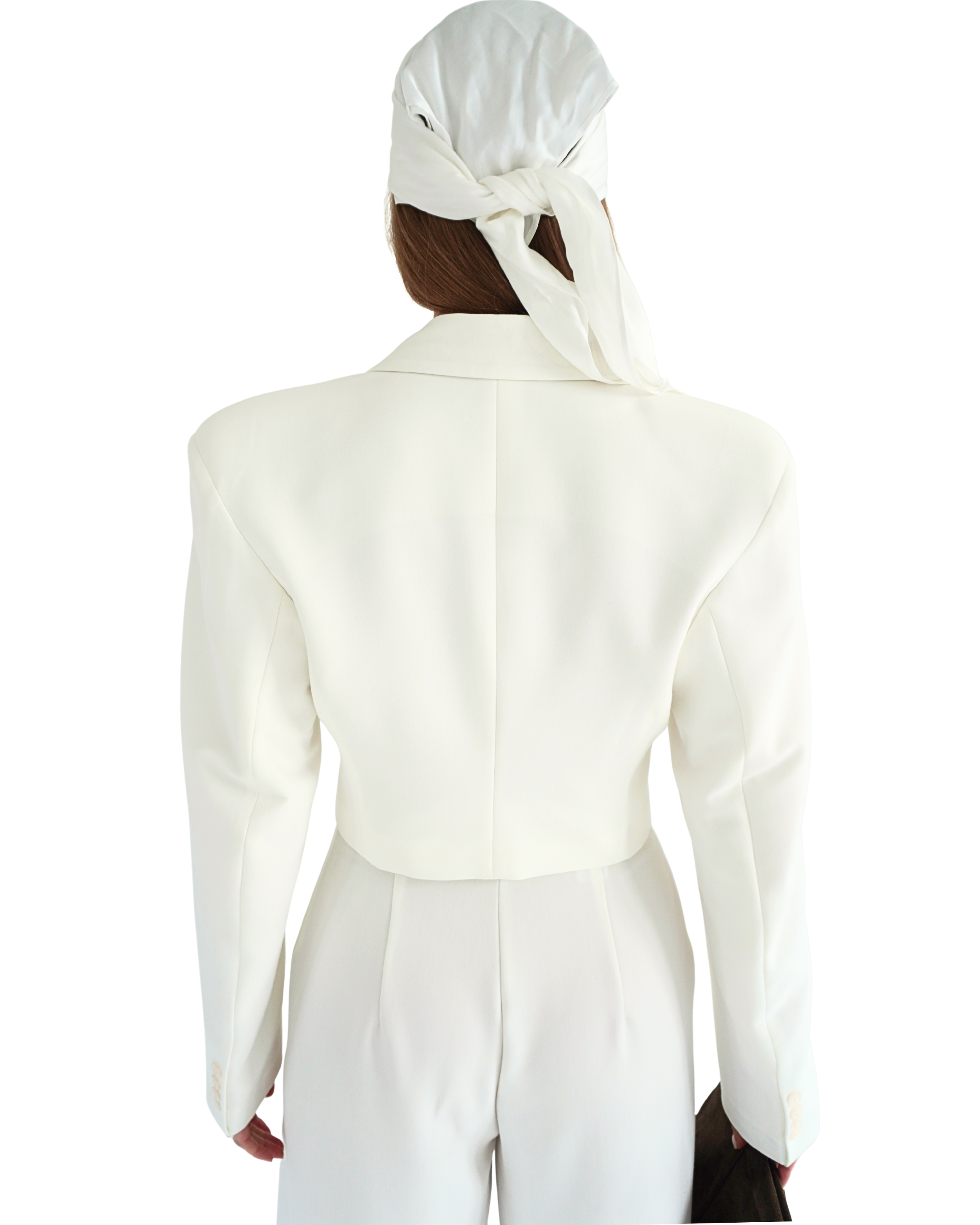Back view of cream crop blazer THÉFI styled with headscarf showing clean lines and fitted silhouette